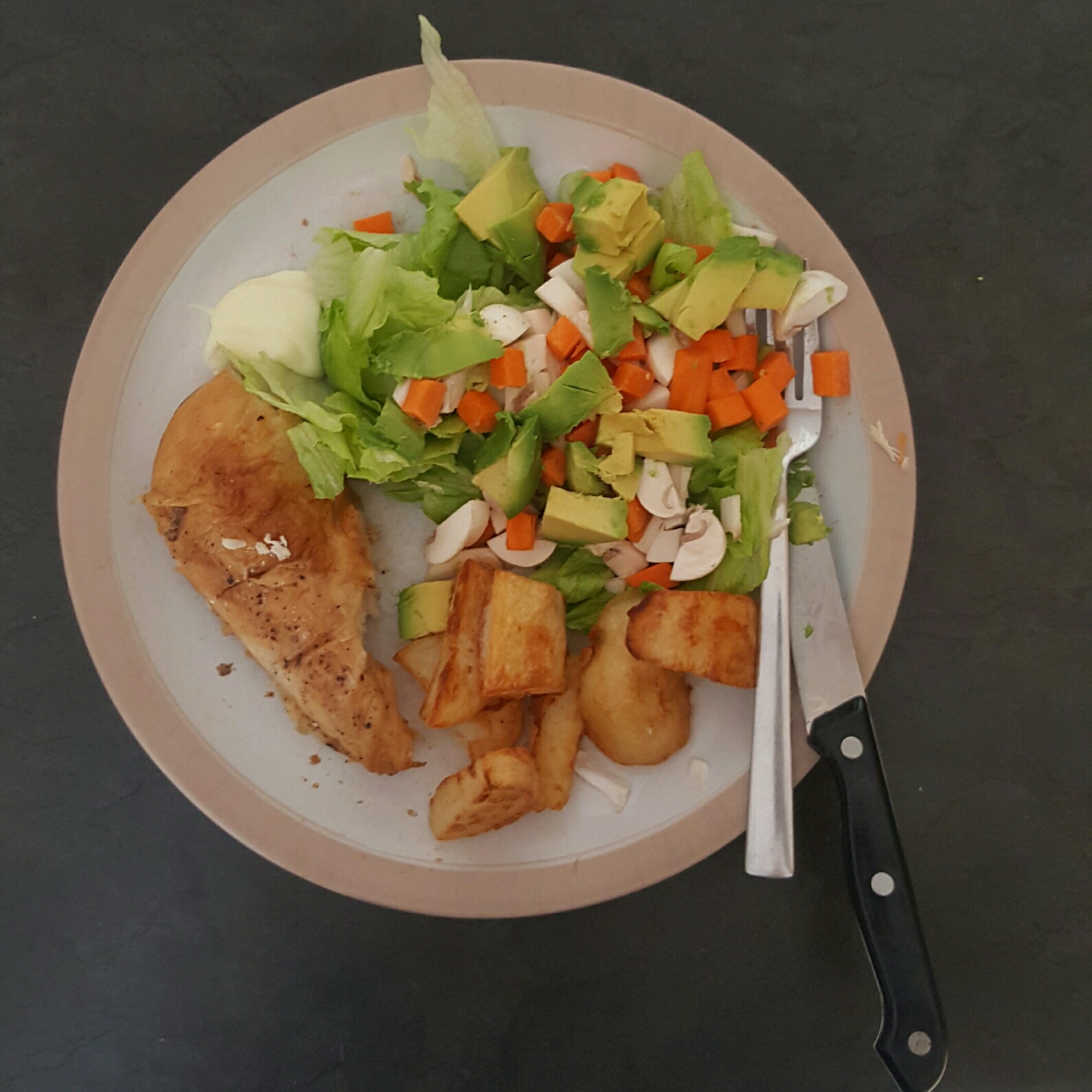 Grilled chicken with roast potatoes and carrot, mushroom, avo salad